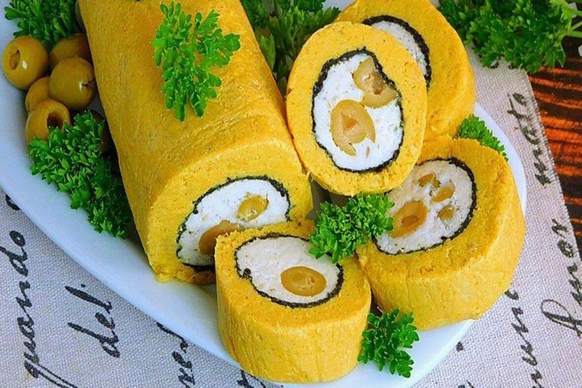 Un aperitiv frumos și delicios pentru masa festivă. O ruladă apetisantă de pește cu măsline va face senzație Un aperitiv frumos și delicios pentru masa festivă. O ruladă apetisantă de pește cu măsline va face senzație
