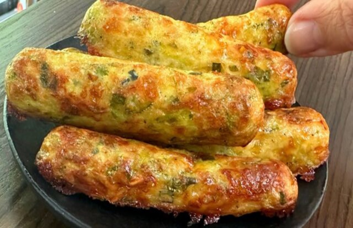 Rulouri de dovlecei la cuptor cu fulgi de ovăz, brânză și ceapă verde – O delicatesă savuroasă!