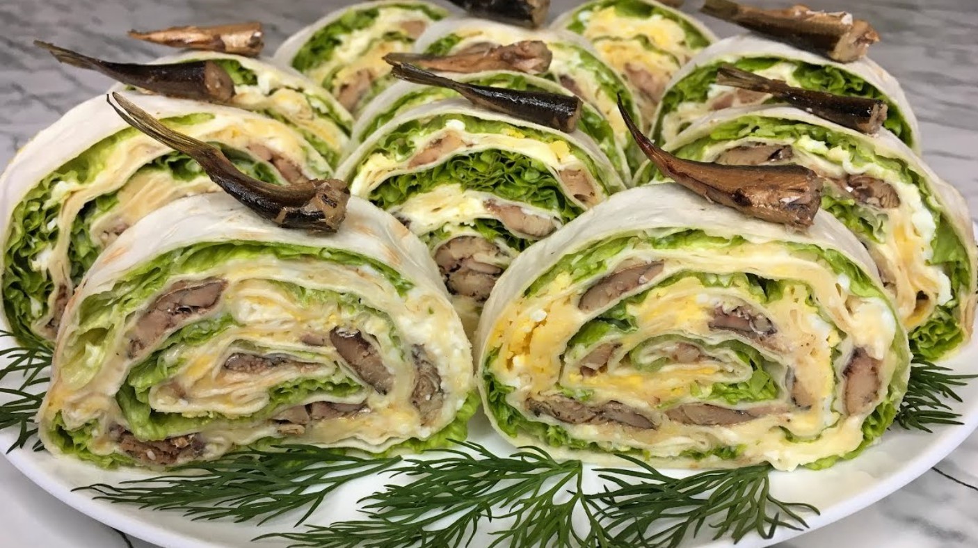 O rețetă simplă și rapidă de aperitiv cu lipie și șprot. Poți prepara asta în doar câteva minute – trebuie doar să înfășori toate ingredientele în lipie